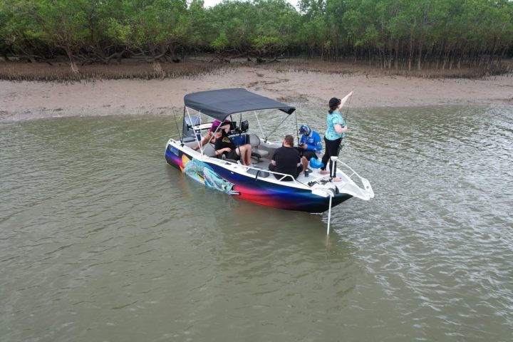 a small boat in a body of water