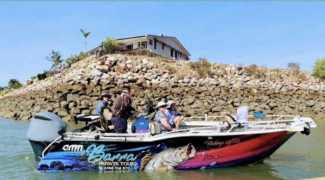 a group of people on a boat in the water