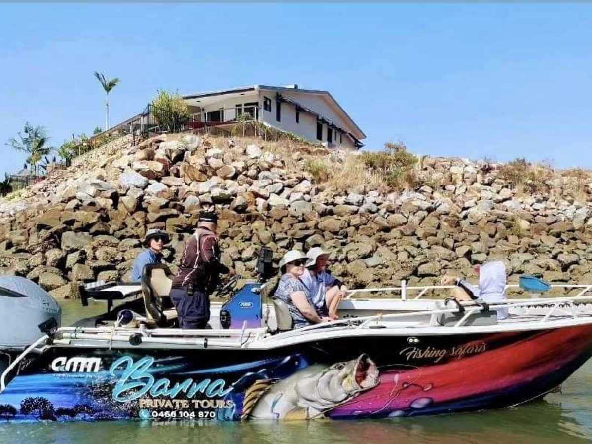 a group of people on a boat in the water