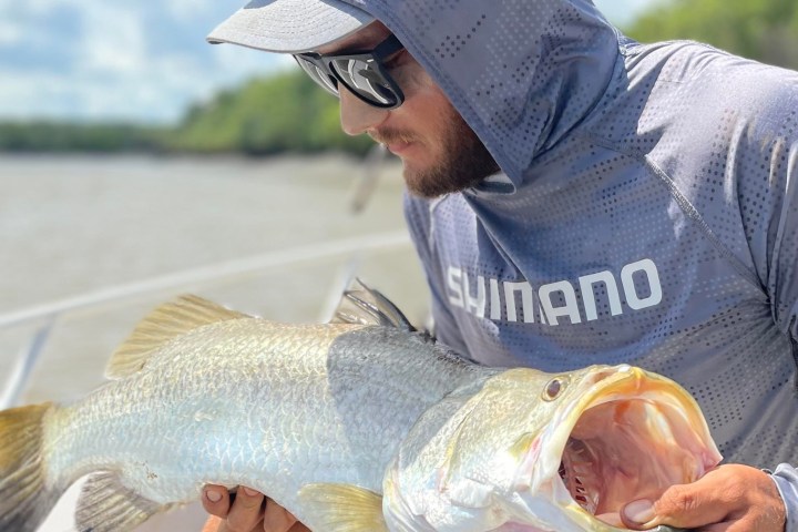 a man holding a fish