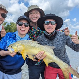 a man and a woman holding a fish