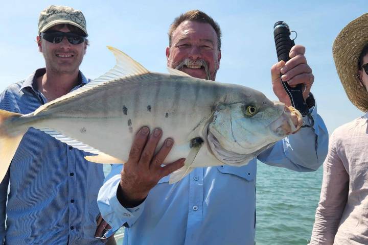 a person holding a fish