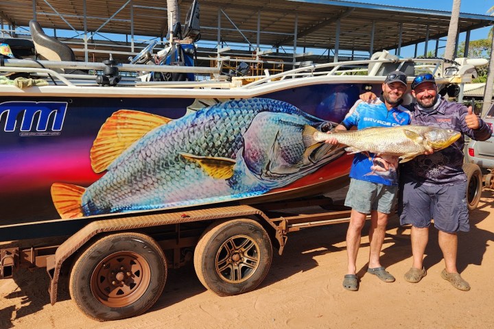 a person standing in front of a truck