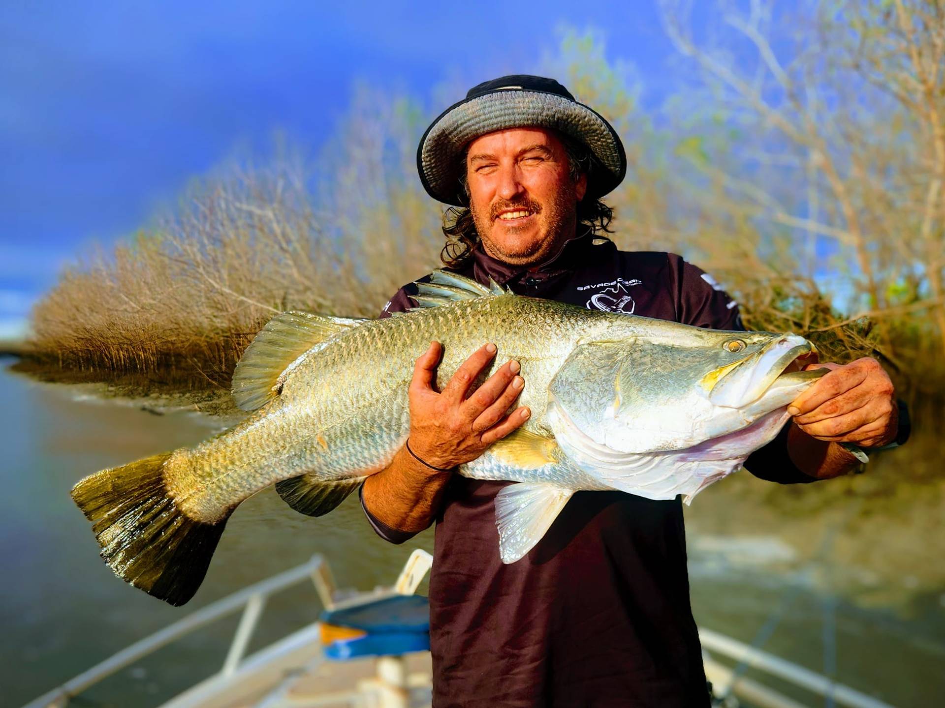 a man holding a fish
