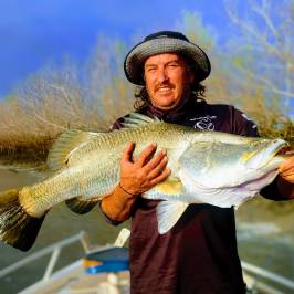 a man holding a fish
